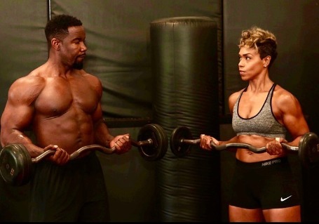 Gillian Iliana Waters lifting some weight along with her husband, Michael Jai White. 